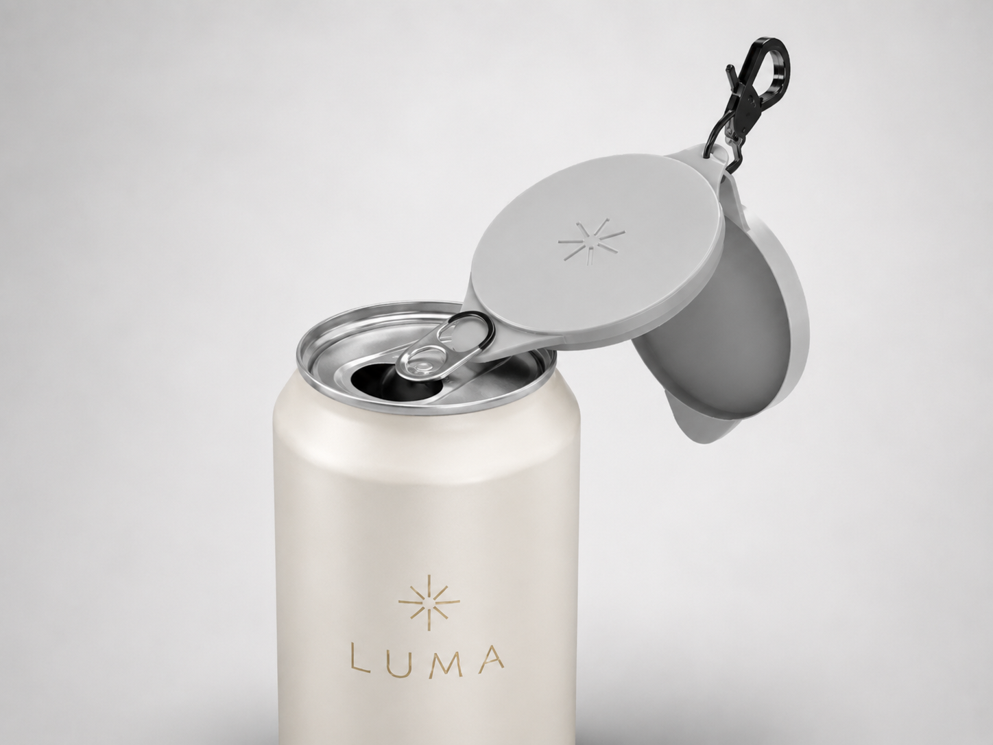 A TwinCaps cover lifting a can tab open without using a fingernail